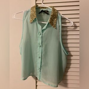 Light blue sleeveless button down with gold sequence